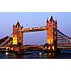 Tower bridge in London England at sunset over Thames river