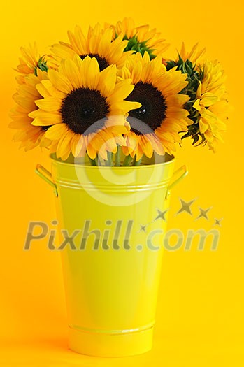 Bouquet of sunflowers in yellow metal vase Bouquet of sunflowers in yellow metal vase
