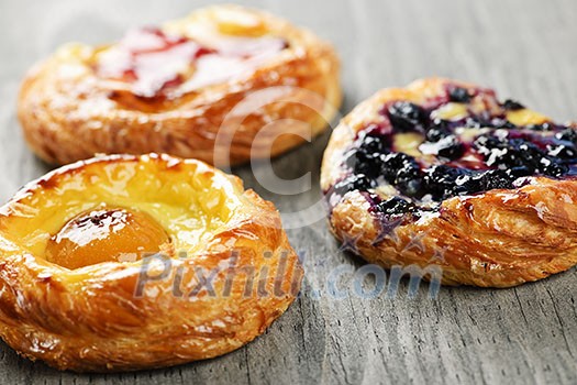 Closeup on three sweet fruit danish desserts Closeup on three sweet fruit danish desserts