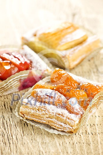 Closeup on slices of flaky fruit strudel desserts Closeup on slices of flaky fruit strudel desserts