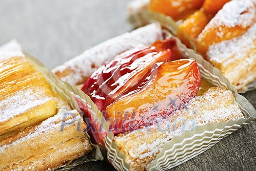 Closeup on slices of flaky fruit strudel desserts Closeup on slices of flaky fruit strudel desserts