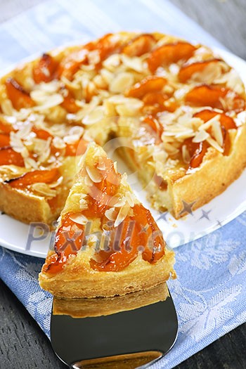 Slice of fresh baked apricot and almond pie dessert Slice of fresh baked apricot and almond pie dessert