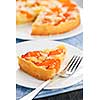 Slice of fresh baked apricot and almond pie dessert