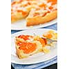 Slice of fresh baked apricot and almond pie dessert