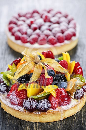 Fresh dessert tarts with assorted fruits and berries Fresh dessert tarts with assorted fruits and berries