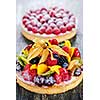Fresh dessert tarts with assorted fruits and berries