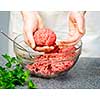 Chef making hamburgers in kitchen with ground beef