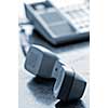 Telephone handset off the hook on desk