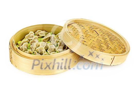 Bamboo steamer with cooked dumplings isolated on white Bamboo steamer with cooked dumplings isolated on white