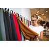 Pretty young woman  choosing the right material/color for her modern appartement interior (shallow DOF; color toned image)