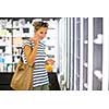 Young woman shopping for the right fragrance/perfume
