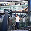 Young female passenger at the airport, transfering to her gate to board her flight on time(color toned image)