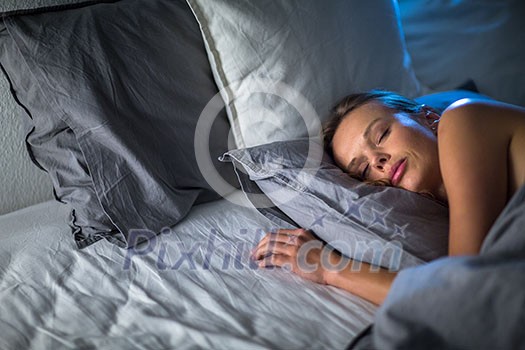 Beautiful young woman sleeping in bed (colour toned image; shallow DOF) Beautiful young woman sleeping in bed (colour toned image; shallow DOF)