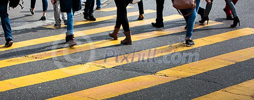 urban traffic concept - city street with a motion blurred crowd crossing a road urban traffic concept - city street with a motion blurred crowd crossing a road