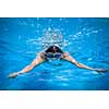 Young man swimming in a pool