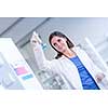 Portrait of a female chemistry student carrying out research in a chemistry lab (color toned image; shallow DOF)