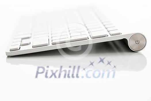 Modern keybord on a white glossy table Modern keybord on a white glossy table