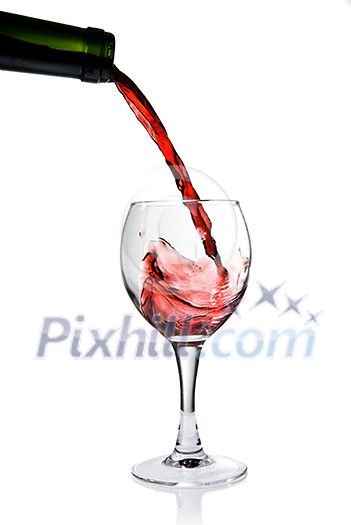 Pouring red wine in goblet isolated on white Pouring red wine in goblet isolated on white