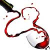 Heart from pouring red wine in goblet isolated on white