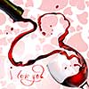 Heart from pouring red wine in goblet isolated on white