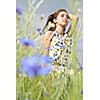 Girl posing in field of flowers