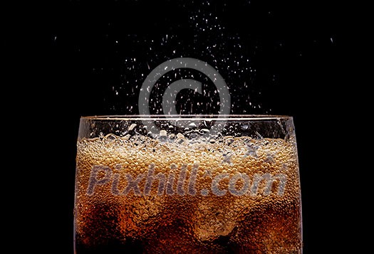 Ice cola with splashing CO bubbles. Drink with ice, closeup, fizzing, fizz. Ice cola with splashing CO bubbles. Drink with ice, closeup, fizzing, fizz.