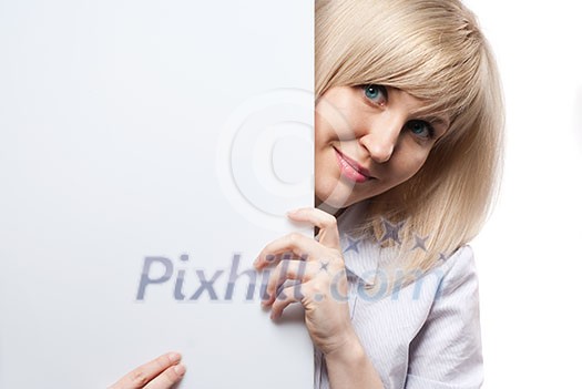 Attractive smiling woman holding white empty paper isolated on white Attractive smiling woman holding white empty paper isolated on white