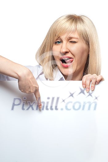 Attractive funny woman holding white empty paper and pointing on it isolated on white Attractive funny woman holding white empty paper and pointing on it isolated on white