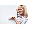 Attractive smiling woman holding white empty paper and pointing on it isolated on white
