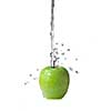 fresh water splash on green apple isolated on white