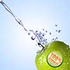 fresh water splash on green apple