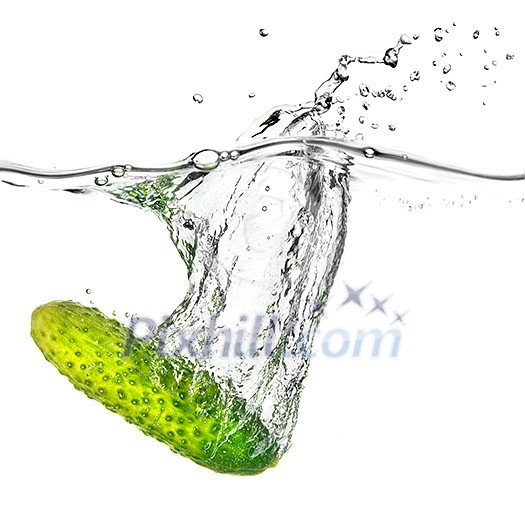 green cucumber dropped into water isolated on white green cucumber dropped into water isolated on white