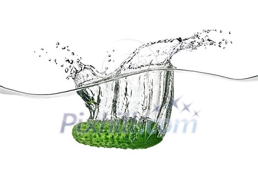 green cucumber dropped into water isolated on white green cucumber dropped into water isolated on white