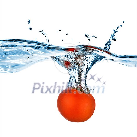 red tomato dropped into water isolated on white red tomato dropped into water isolated on white