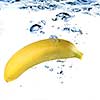 banana dropped into water isolated on white