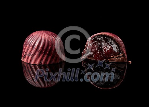 tasty yellow chocolate candy on a black background tasty yellow chocolate candy on a black background