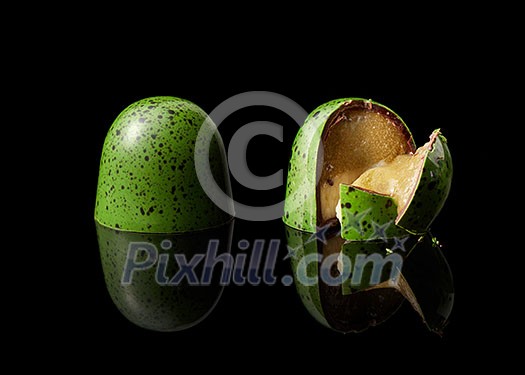 tasty yellow chocolate candy on a black background tasty yellow chocolate candy on a black background