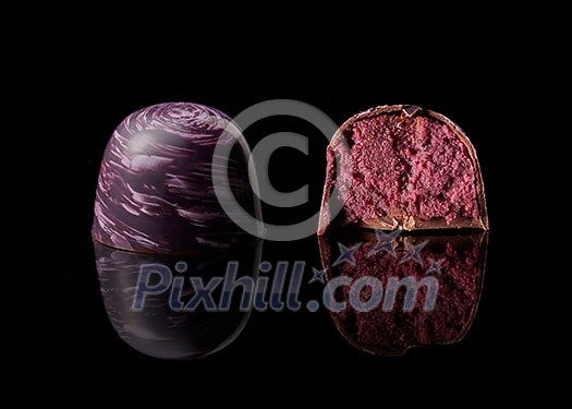 tasty yellow chocolate candy on a black background tasty yellow chocolate candy on a black background