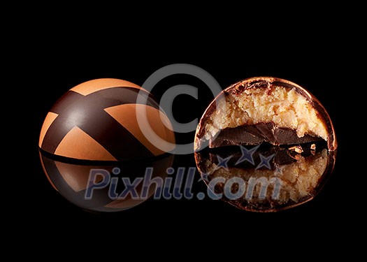 tasty yellow chocolate candy on a black background tasty yellow chocolate candy on a black background