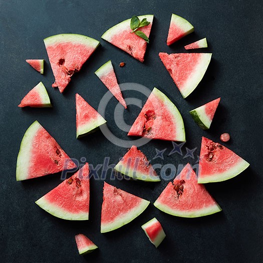 slices of watermelon with mint isolated on black background slices of watermelon with mint isolated on black background