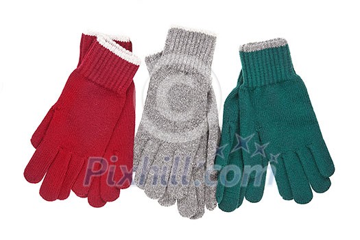 Three pair of colored gloves. Winter accessories isolated on white background. Three pair of colored gloves. Winter accessories isolated on white background.