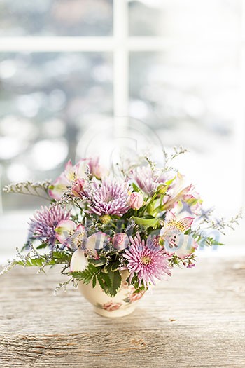 Bouquet of colorful flowers arranged in small vase Bouquet of colorful flowers arranged in small vase