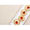 Caviar and goat cheese appetizer on white plate from above with copy space