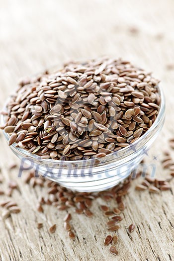 Bowl full of brown flax seed or linseed Bowl full of brown flax seed or linseed