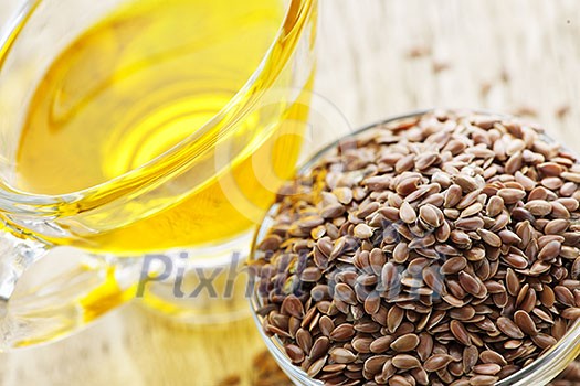 Bowl of brown flax seed and linseed oil Bowl of brown flax seed and linseed oil