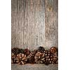 Rustic natural wooden background with pine cones