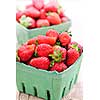 Two containers of fresh organic red strawberries