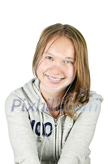 Isolated portrait of beautiful teenage girl listening to earphones Isolated portrait of beautiful teenage girl listening to earphones