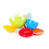 Various colorful plastic kitchen utensils on white background
