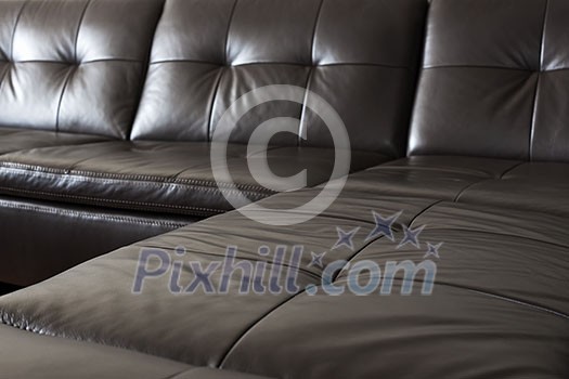 Closeup of luxurious expensive black leather couch Closeup of luxurious expensive black leather couch